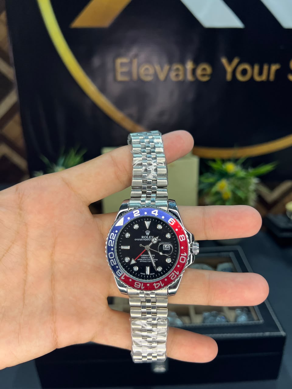 Rolex GMT-Master II Pepsi Bezel – held in hand, stainless steel Jubilee bracelet, black dial